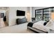 A spacious, bright main bedroom with a large window, stylish furniture, and city views at 40 12Th Ne St # 1406, Atlanta, GA 30309