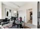 Contemporary office featuring a large window, stylish desk, and telescope at 40 12Th Ne St # 1406, Atlanta, GA 30309