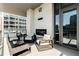 Outdoor patio with comfortable seating, fireplace, and views of the city at 40 12Th Ne St # 1406, Atlanta, GA 30309