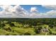 Expansive aerial view of golf course, clubhouse, and wooded areas, showcasing the community's green space at 4708 Tall Pines Nw Dr, Atlanta, GA 30327