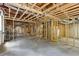 Unfinished basement shows exposed framework and ceiling, offering potential for customization at 4708 Tall Pines Nw Dr, Atlanta, GA 30327