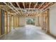 Unfinished basement space, framed and ready to be customized with a walk-out exit at 4708 Tall Pines Nw Dr, Atlanta, GA 30327