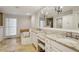Well-lit bathroom with double vanity, granite countertops, and a separate soaking tub at 4708 Tall Pines Nw Dr, Atlanta, GA 30327