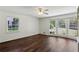 Bedroom with three windows and wood paneling at 4708 Tall Pines Nw Dr, Atlanta, GA 30327