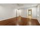Large bedroom featuring wood floors, a ceiling fan, and two entryways at 4708 Tall Pines Nw Dr, Atlanta, GA 30327