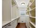 Walk-in closet with custom shelves and drawers, and a window at 4708 Tall Pines Nw Dr, Atlanta, GA 30327