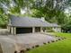 Charming single-story home boasts an attached garage, long driveway, and mature trees at 4708 Tall Pines Nw Dr, Atlanta, GA 30327