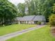 Wide angle shot of the front of the home with driveway at 4708 Tall Pines Nw Dr, Atlanta, GA 30327