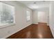 Hallway featuring hardwood floors, white trim, neutral paint and natural light from the windows at 4708 Tall Pines Nw Dr, Atlanta, GA 30327