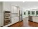 Eat in kitchen with stainless steel appliances, granite countertops, and hardwood floors at 4708 Tall Pines Nw Dr, Atlanta, GA 30327