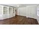 Living room with built in bookshelves, wood floors, and natural light at 4708 Tall Pines Nw Dr, Atlanta, GA 30327