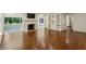 Bright living room with hardwood floors, fireplace, built-in shelves, and a screened porch at 4708 Tall Pines Nw Dr, Atlanta, GA 30327