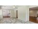 Open living room featuring tile floors and white brick walls at 4708 Tall Pines Nw Dr, Atlanta, GA 30327