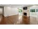 Spacious living room with hardwood floors, fireplace and natural light from the windows at 4708 Tall Pines Nw Dr, Atlanta, GA 30327