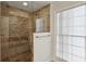 Tiled walk-in shower with glass door at 4708 Tall Pines Nw Dr, Atlanta, GA 30327