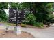 Community signage indicates the location of the amphitheater, horse park, grills, trails, parking, and schools at 4708 Tall Pines Nw Dr, Atlanta, GA 30327
