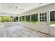 Bright sunroom with white brick walls, tile floors and natural light at 4708 Tall Pines Nw Dr, Atlanta, GA 30327