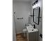 Modern bathroom featuring a stylish sink and black hardware and shelving at 775 Lee Andrews Se Ave, Atlanta, GA 30315