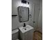 Modern bathroom featuring a stylish sink and black hardware and shelving at 775 Lee Andrews Se Ave, Atlanta, GA 30315