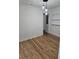 Bedroom featuring hardwood floors, fresh white paint, and access to a large closet at 775 Lee Andrews Se Ave, Atlanta, GA 30315