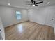 Bright bedroom with wood laminate flooring and a modern ceiling fan at 775 Lee Andrews Se Ave, Atlanta, GA 30315
