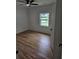 Bedroom featuring hardwood floors, a ceiling fan, and ample natural light at 775 Lee Andrews Se Ave, Atlanta, GA 30315