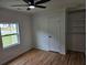 Bright bedroom with hardwood floors, ceiling fan, built in shelving, and natural light at 775 Lee Andrews Se Ave, Atlanta, GA 30315