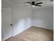 Spacious bedroom with wood laminate flooring, ceiling fan, and modern design at 775 Lee Andrews Se Ave, Atlanta, GA 30315
