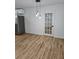 Dining area featuring hardwood floors, a modern door, and pendant lighting at 775 Lee Andrews Se Ave, Atlanta, GA 30315