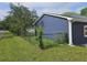 Dark blue house with a fenced in yard, with green grass and a sidewalk at 775 Lee Andrews Se Ave, Atlanta, GA 30315