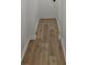 Hallway with hardwood floors, white trim, and neutral paint at 775 Lee Andrews Se Ave, Atlanta, GA 30315