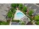 A serene pool surrounded by community townhomes, beautiful landscaping and lounge area at 359 Alderwood Ln, Atlanta, GA 30328