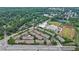 Aerial view of a townhome community surrounded by mature trees, with easy access to nearby amenities at 359 Alderwood Ln, Atlanta, GA 30328
