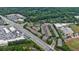 Aerial view of a townhome community surrounded by mature trees, close to commercial areas at 359 Alderwood Ln, Atlanta, GA 30328