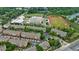 Aerial view of a townhome community surrounded by mature trees, showcasing proximity to schools and sports fields at 359 Alderwood Ln, Atlanta, GA 30328