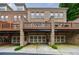 Brick townhomes featuring garage parking and a charming second story outdoor deck at 359 Alderwood Ln, Atlanta, GA 30328