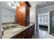 The bathroom features double sinks, granite countertops, and dark wood cabinets at 359 Alderwood Ln, Atlanta, GA 30328