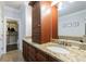 A spacious bathroom with double sinks, granite countertops, and a large walk-in closet for ample storage at 359 Alderwood Ln, Atlanta, GA 30328