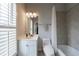 Bathroom featuring tiled shower-tub combo, white vanity and neutral color palette at 359 Alderwood Ln, Atlanta, GA 30328