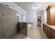 A stunning bathroom featuring a tiled shower, soaking tub, granite counters, and walk-in closet access at 359 Alderwood Ln, Atlanta, GA 30328