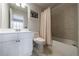 Bathroom with a tub-shower combination and a white vanity cabinet at 359 Alderwood Ln, Atlanta, GA 30328