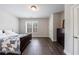 Bedroom featuring hardwood floors, natural light and a dark wood dresser at 359 Alderwood Ln, Atlanta, GA 30328