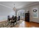 Traditional dining room with a dark wood table, globe chandelier, arched window with shutter-style blinds at 359 Alderwood Ln, Atlanta, GA 30328