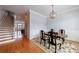 Elegant dining room with hardwood floors and pendant lighting fixture at 359 Alderwood Ln, Atlanta, GA 30328