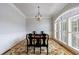 Elegant dining room features hardwood floors, large window, and stylish light fixture at 359 Alderwood Ln, Atlanta, GA 30328