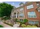 Attractive townhome exterior with brick facade, dormer windows, and landscaped entryway at 359 Alderwood Ln, Atlanta, GA 30328