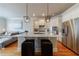 Open concept kitchen with white cabinets, stainless steel appliances, and an island with a marble countertop at 359 Alderwood Ln, Atlanta, GA 30328