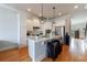 Open concept kitchen with white cabinets, stainless steel appliances, and an island with a marble countertop at 359 Alderwood Ln, Atlanta, GA 30328