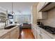Open concept kitchen with white cabinets, stainless steel appliances, and a view of living space at 359 Alderwood Ln, Atlanta, GA 30328