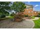 Charming landscaping with a bricked island in the driveway and manicured lawn at 359 Alderwood Ln, Atlanta, GA 30328